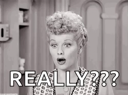 A Black And White Photo Of A Woman Making A Surprised Face And The Words `` Really '' . GIF