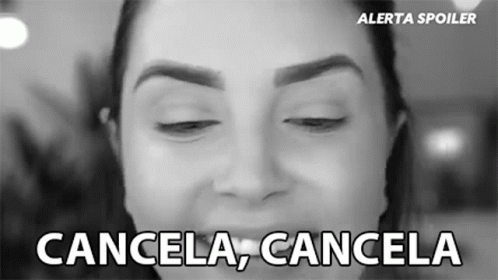 A Black And White Photo Of A Woman 'S Face With The Words Cancela Cancela Below It GIF