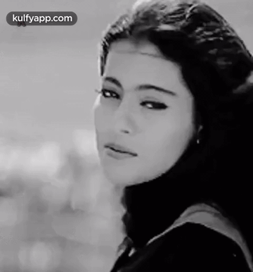 A Black And White Photo Of A Woman 'S Face With The Words Kulfyapp.com At The Bottom GIF