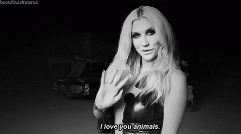 A Black And White Photo Of A Woman Saying `` I Love You Animals '' . GIF