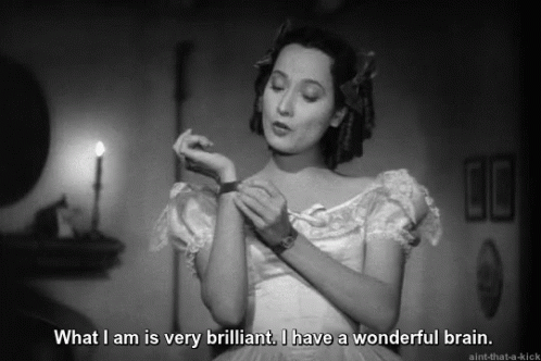 A Black And White Photo Of A Woman Saying What I Am Is Very Brilliant I Have A Wonderful Brain . GIF