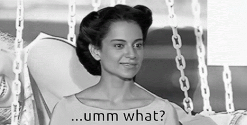 A Black And White Photo Of A Woman Sitting In A Chair With The Words Umm What Written On The Bottom . GIF