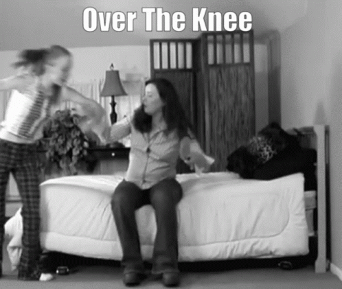 A Black And White Photo Of A Woman Sitting On A Bed With The Words Over The Knee Above Her GIF