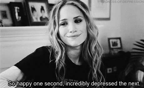 A Black And White Photo Of A Woman Smiling And Saying `` So Happy One Second , Incredibly Depressed The Next . '' GIF