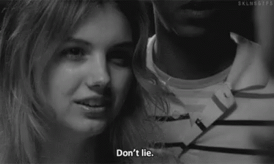 A Black And White Photo Of A Woman Smiling Next To A Man With The Words `` Don 'T Lie '' . GIF