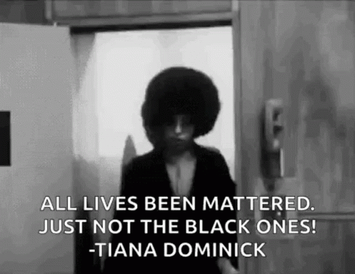 A Black And White Photo Of A Woman Standing In Front Of A Door With A Quote . GIF