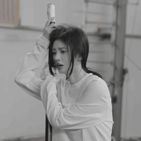 A Black And White Photo Of A Woman Taking A Selfie GIF