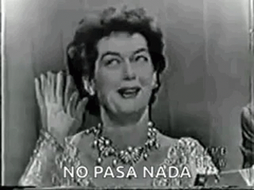 A Black And White Photo Of A Woman Waving Her Hand In A Foreign Language . GIF