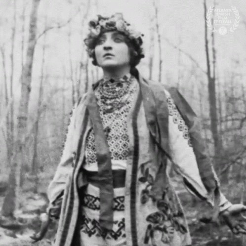 Black And White Photo Of Woman With Floral Hat GIF
