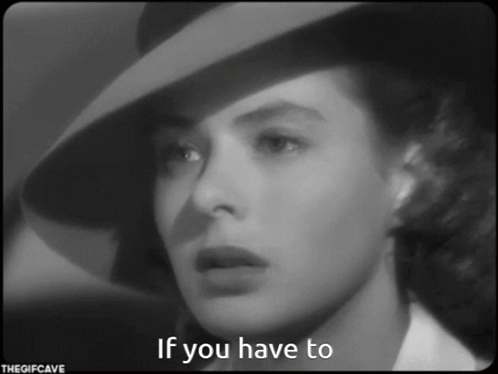 a black and white photo of a woman wearing a hat with the caption if you have to