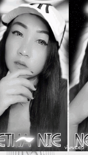 A Black And White Photo Of A Woman Wearing A Hat With The Word Ethan On The Bottom Right GIF