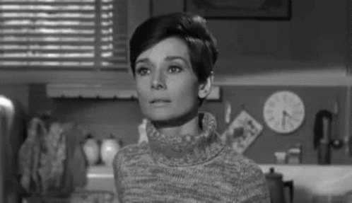 Black And White Photo Of Woman In Turtleneck Kitchen GIF