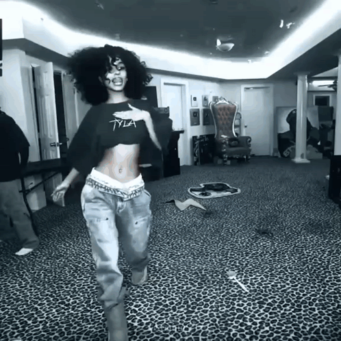 A Black And White Photo Of A Woman Wearing A Tyia Crop Top GIF