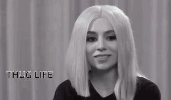 A Black And White Photo Of A Woman Wearing Sunglasses . GIF