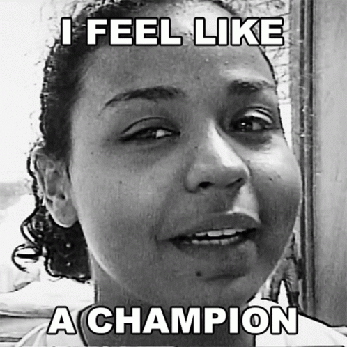 A Black And White Photo Of A Woman With A Caption That Says " I Feel Like A Champion " GIF