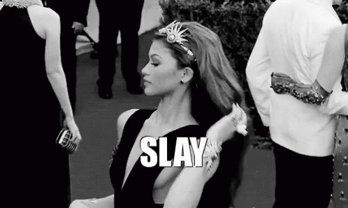 A Black And White Photo Of A Woman With A Crown On Her Head And The Words `` Slay '' Written Above Her . GIF