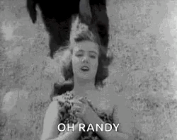 A Black And White Photo Of A Woman With Her Eyes Closed And The Words `` Oh Randy '' Written On It . GIF