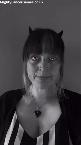A Black And White Photo Of A Woman With Horns And The Words Mightylancergames.co.uk At The Bottom GIF