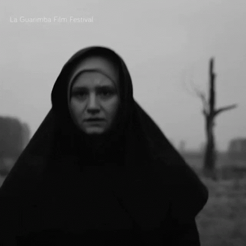 A Black And White Photo Of A Woman With La Guarimba Film Festival Written On The Bottom GIF