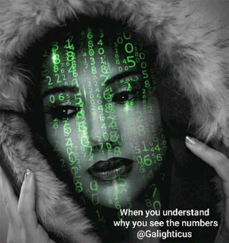 A Black And White Photo Of A Woman With Numbers On Her Face GIF