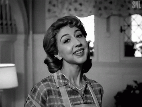 A Black And White Photo Of A Woman With The Letters Snl On The Bottom Right GIF