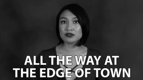 A Black And White Photo Of A Woman With The Words " All The Way At The Edge Of Town " GIF