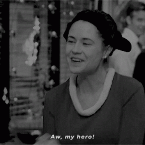 A Black And White Photo Of A Woman With The Words Aw My Hero GIF