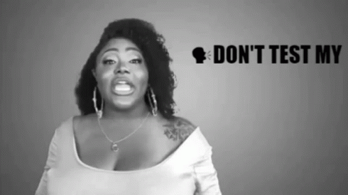 A Black And White Photo Of A Woman With The Words " Do N't Test My " Behind Her GIF