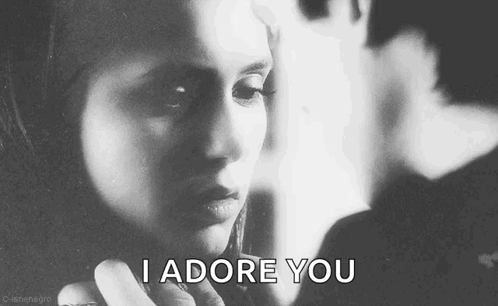 A Black And White Photo Of A Woman With The Words `` I Adore You '' Written Next To Her . GIF