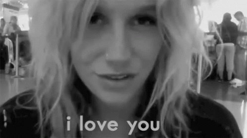 A Black And White Photo Of A Woman With The Words I Love You Behind Her GIF