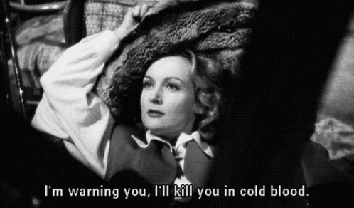 A Black And White Photo Of A Woman With The Words I 'M Warning You I 'Ll Kill You In Cold Blood Below Her GIF