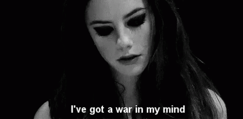 A Black And White Photo Of A Woman With The Words `` I 'Ve Got A War In My Mind '' Written On It . GIF