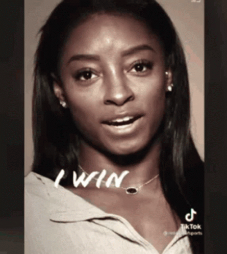 A Black And White Photo Of A Woman With The Words " I Win " Written On Her Neck GIF
