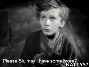 A Black And White Photo Of A Young Boy Holding A Bowl And Asking For Some More . GIF