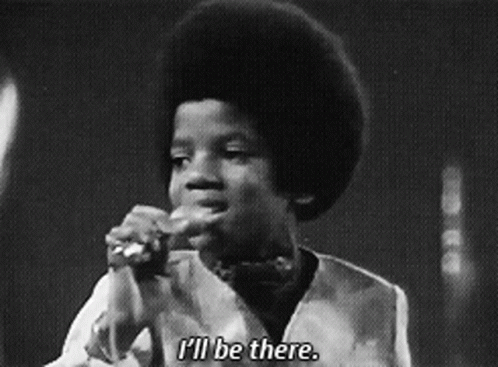 A Black And White Photo Of A Young Boy Singing Into A Microphone And Saying I 'Ll Be There GIF