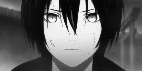 A Black And White Photo Of A Young Boy With Long Black Hair And Big Eyes . GIF