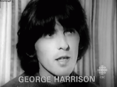 A Black And White Photo Of A Young Man Named George Harrison In A Sweater . GIF