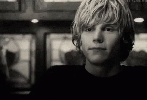 A Black And White Photo Of A Young Man 'S Face GIF