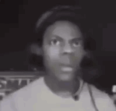 A Black And White Photo Of A Young Man Wearing Headphones And A Hat . GIF