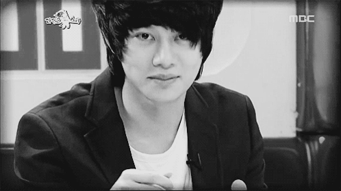A Black And White Photo Of A Young Man With The Word Mbc On The Bottom GIF