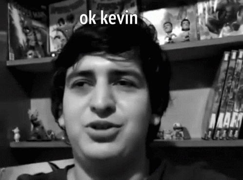 A Black And White Photo Of A Young Man With The Words Ok Kevin Above Him GIF