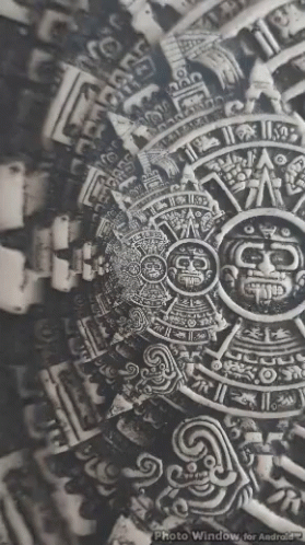 A Black And White Photo Of An Ancient Mexican Calendar . GIF