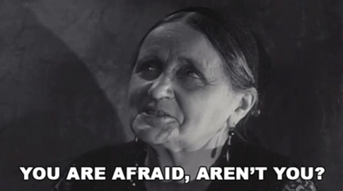 A Black And White Photo Of An Elderly Woman Saying You Are Afraid Aren 'T You GIF