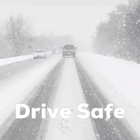 A Black And White Photo Of Cars Driving Down A Snowy Road GIF