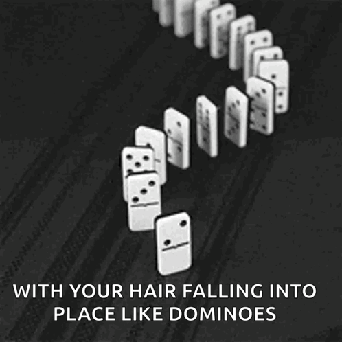 A Black And White Photo Of Dominoes Falling Into Place GIF