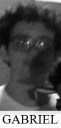 A Black And White Photo Of Gabriel With Glasses On GIF