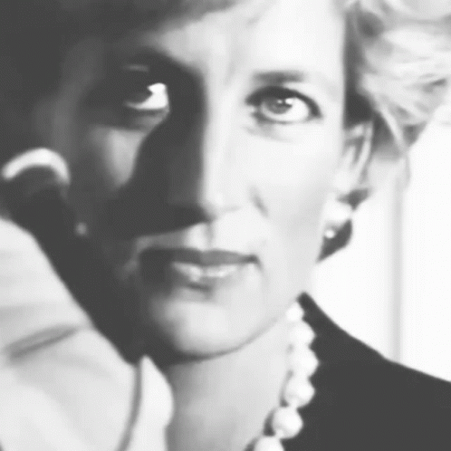 A Black And White Photo Of Princess Diana Wearing A Pearl Necklace . GIF