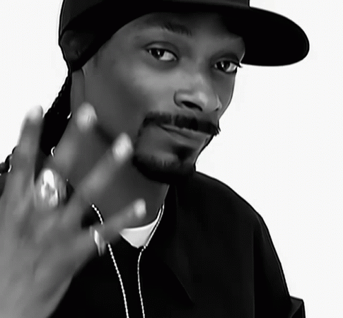A Black And White Photo Of Snoop Dogg Wearing A Black Hat GIF