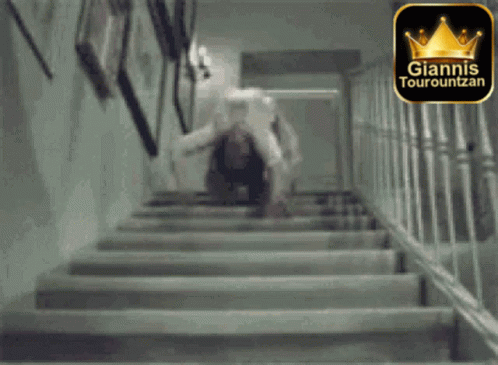 A Black And White Photo Of Stairs With A Giannis Tourountzan Logo GIF