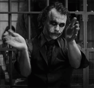 A Black And White Photo Of The Joker From The Movie The Dark Knight Rises . GIF